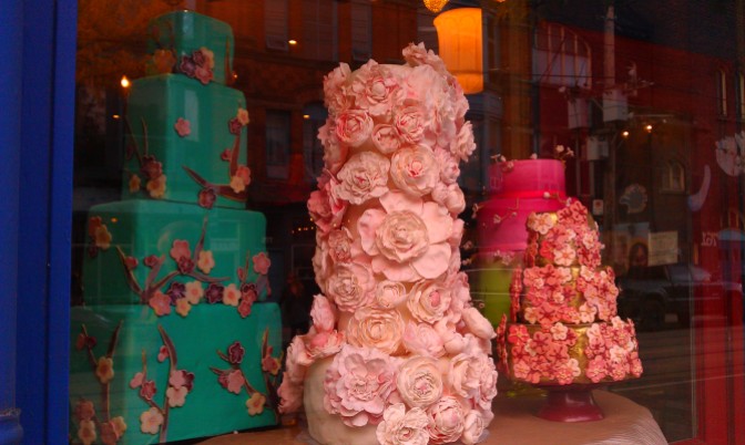 Gorgeous cakes in turquoise, pink, and gold fondant icing and decorated with different flowers